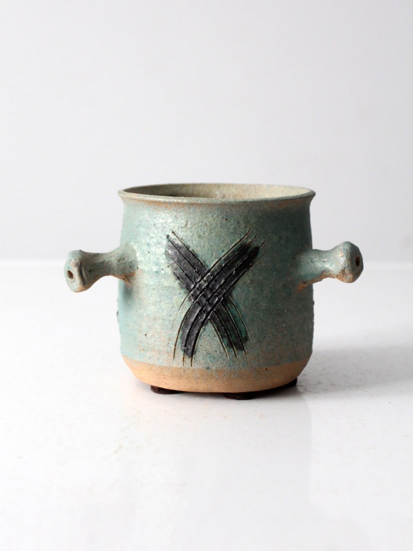 Handmade Celadon Green Vintage Studio Pottery Vase with Knobbed Handles: Handmade Celadon Green Vintage Studio Pottery Vase with Knobbed Handles This vintage studio pottery vase showcases a unique handmade celadon green cachepot design. It features three distinct knobbed h