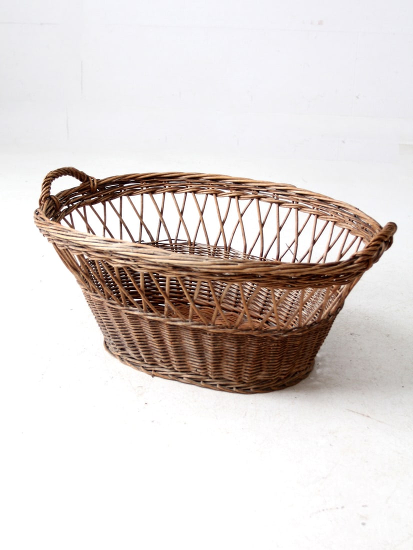 Antique Wicker Laundry Basket Charming French Design 28x19x12.5: Antique Wicker Laundry Basket Charming French Design 28x19x12.5 This vintage wicker laundry basket features a classic woven design and open weave detailing, embodying a charming French countryside aes