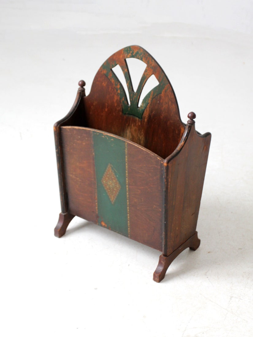 Antique Art Nouveau Wooden Magazine Rack Late 1800s Green Gold Accents: Antique Art Nouveau Wooden Magazine Rack Late 1800s Green Gold Accents This antique Art Nouveau wooden magazine rack, dating back to the late 1800s, showcases elegant, stylized cut-outs complemented b