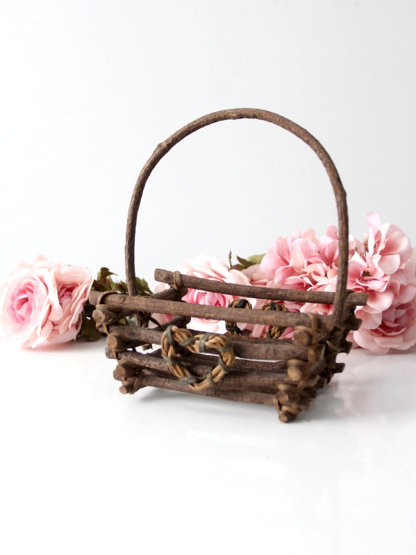 Adirondack Vintage Rustic Twig Basket with Heart Motif: Adirondack Vintage Rustic Twig Basket with Heart Motif This vintage rustic twig basket embodies the charm of Adirondack style with its floral motif and woven heart-shaped wreath ornament on both the f