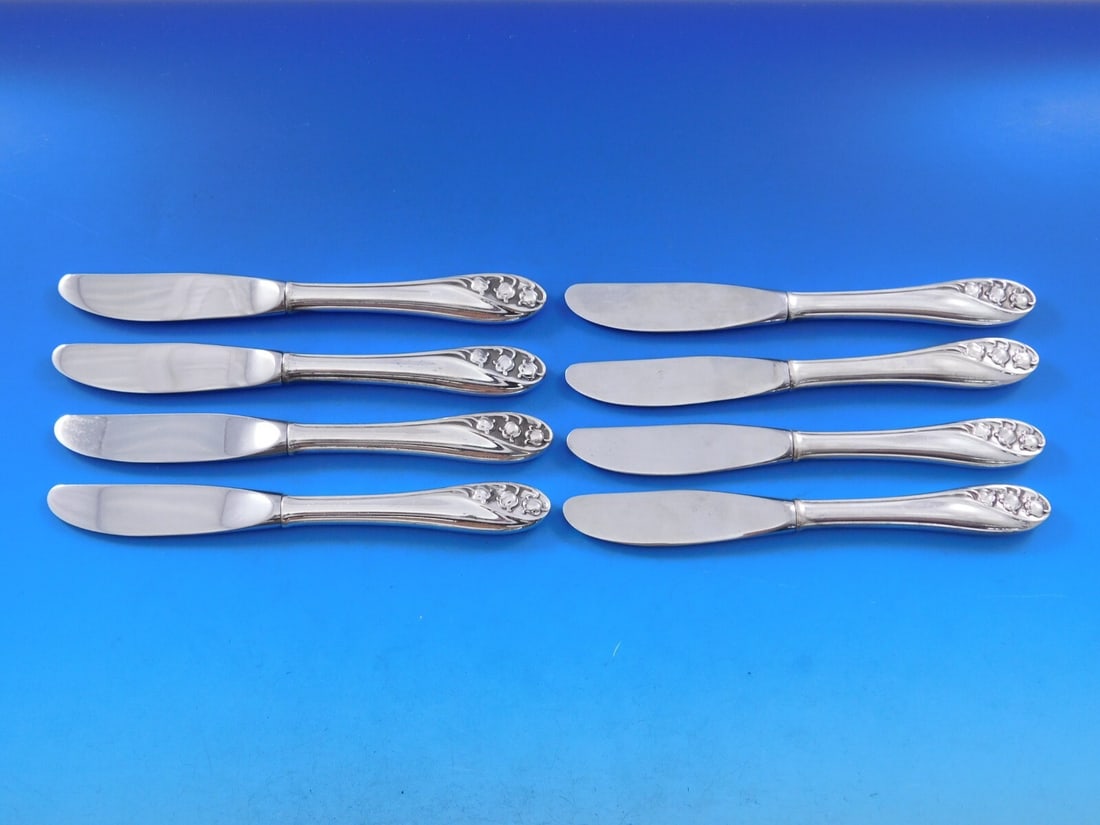 Gorham Lily of the Valley Sterling Silver Butter Spreader Set 8 pcs: Gorham Lily of the Valley Sterling Silver Butter Spreader Set 8 pcs Enhance your dining experience with this exquisite set of 8 butter spreaders by Gorham, featuring the elegant Lily of the Valley pat