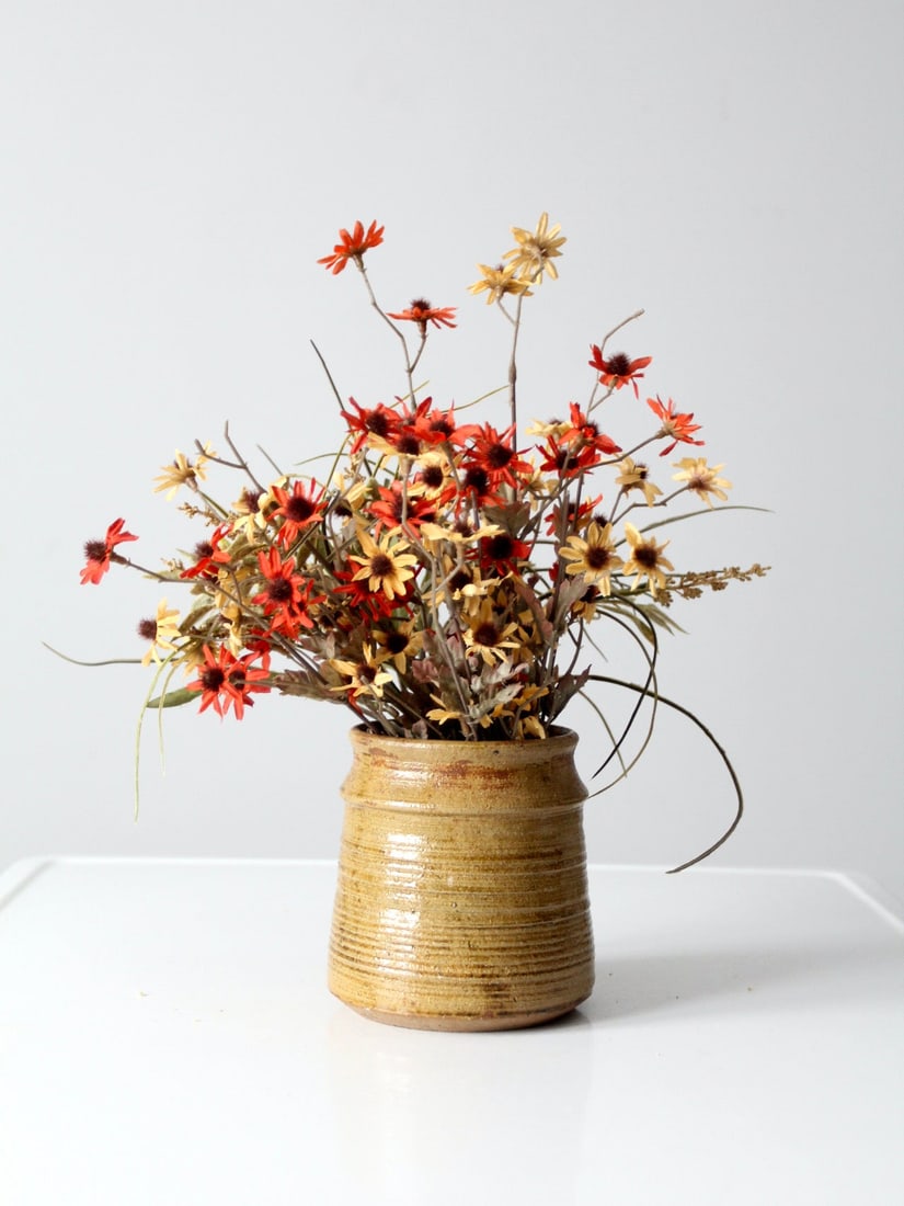 Handcrafted Vintage Studio Pottery Vase with Tawny Golden Glaze: Handcrafted Vintage Studio Pottery Vase with Tawny Golden Glaze This vintage studio pottery vase showcases the unique craftsmanship of its artist, featuring a stunning tawny golden glaze that enhances