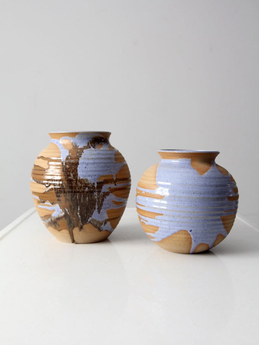 Signed Vintage Studio Pottery Vases Pair in Periwinkle Blue and Brown: Signed Vintage Studio Pottery Vases Pair in Periwinkle Blue and Brown Add a touch of elegance to your space with this exquisite pair of vintage studio pottery vases. Each vase is handmade and wheel-tu