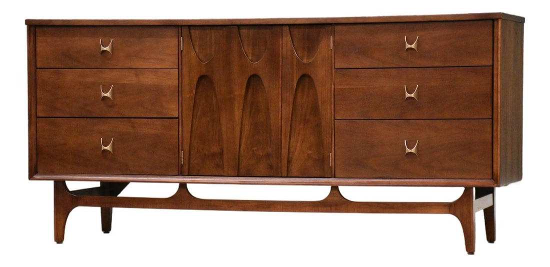 1960s Broyhill Brasilia Walnut Dresser with Brass Pulls: 1960s Broyhill Brasilia Walnut Dresser with Brass Pulls This stunning mid-century modern dresser showcases a classic design with nine dovetail drawers, expertly crafted from walnut and featuring polis
