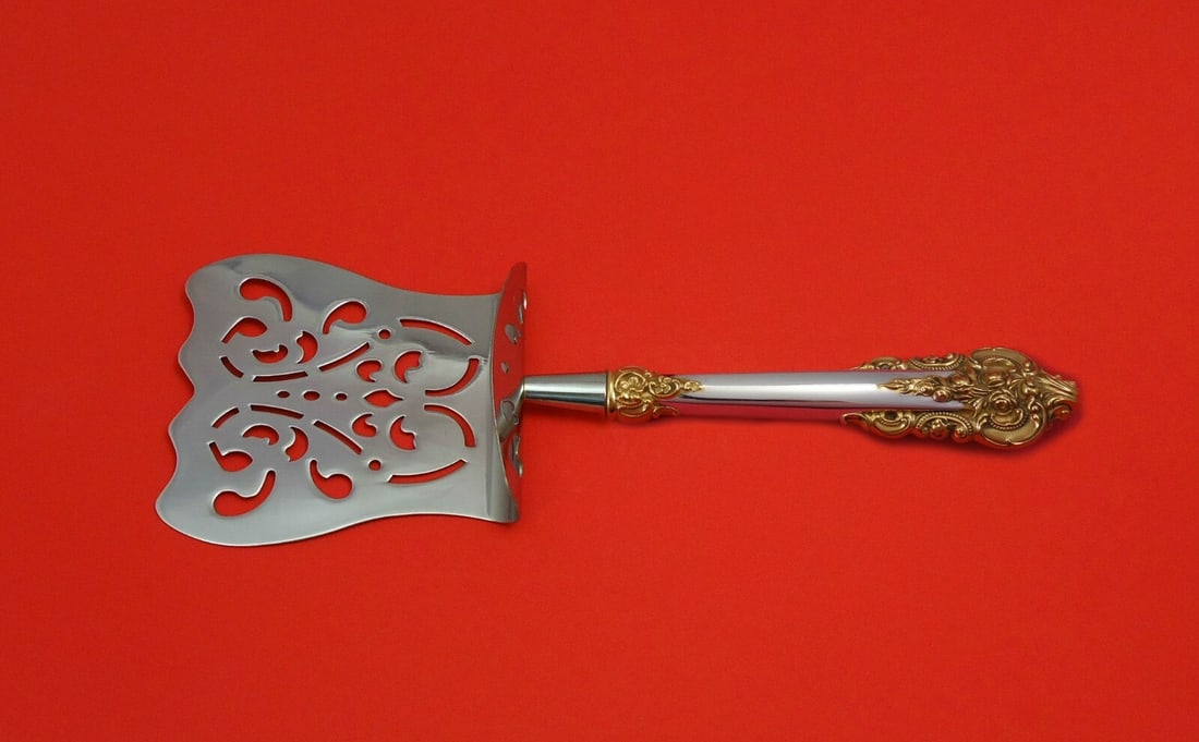 Wallace Grande Baroque Gold Accents Sterling Silver Asparagus Server 9.5": Wallace Grande Baroque Gold Accents Sterling Silver Asparagus Server 9.5" This exquisite asparagus server features the Grande Baroque Gold Accents pattern by Wallace, renowned for its elegant design.