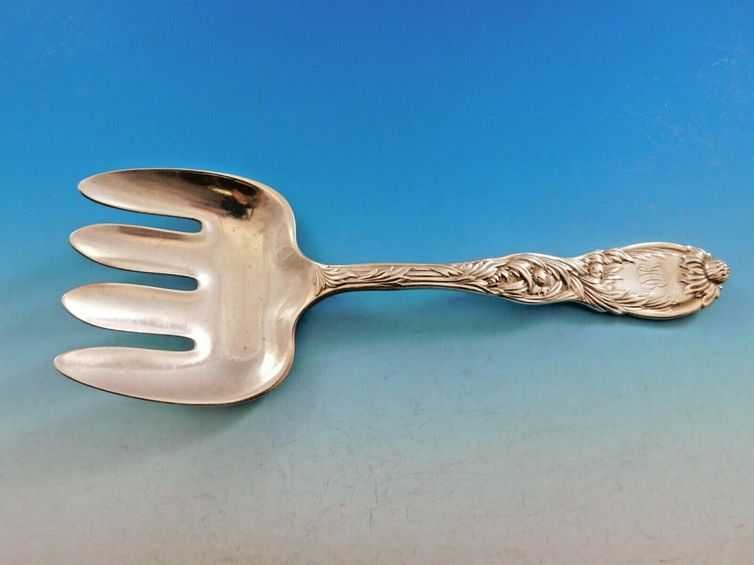 Tiffany & Co Chrysanthemum Sterling Silver Fish Serving Fork 8.5": Tiffany & Co Chrysanthemum Sterling Silver Fish Serving Fork 8.5" Introducing the exquisite Chrysanthemum Fish Serving Fork by Tiffany & Co., a stunning piece crafted from sterling silver, dating back