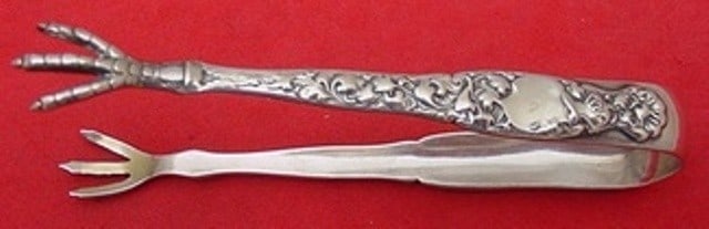 Whiting Heraldic Sterling Silver Sugar Tong 4 1/8 Inch: Whiting Heraldic Sterling Silver Sugar Tong 4 1/8 Inch This exquisite sugar tong from Whiting showcases the classic Heraldic pattern, crafted from high-quality sterling silver. Measuring 4 1/8 inches,