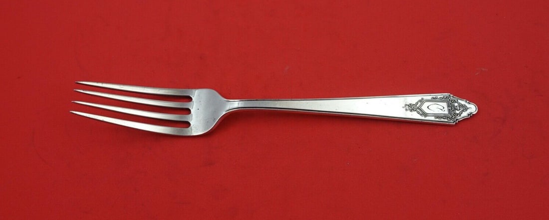 Lunt Granado Sterling Silver Dinner Fork 7 5/8" Heirloom: Lunt Granado Sterling Silver Dinner Fork 7 5/8" Heirloom This exquisite dinner fork from the Granado pattern by Lunt is crafted from high-quality sterling silver, measuring 7 5/8" in length. It showca