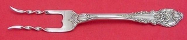 Sir Christopher Wallace Custom Sterling Silver Baked Potato Fork 7 1/4": Sir Christopher Wallace Custom Sterling Silver Baked Potato Fork 7 1/4" This exquisite serving fork is custom made in the Sir Christopher pattern by Wallace, crafted from high-quality sterling silver.
