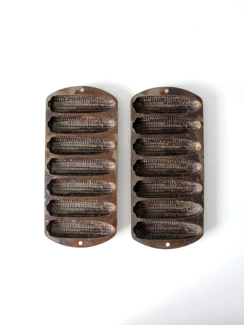 Vintage Lodge Cast Iron Cornbread Pans 2 Piece Set: Vintage Lodge Cast Iron Cornbread Pans 2 Piece Set This pair of vintage Lodge cast iron cornbread pans is designed for creating delightful cornbread cakes, each featuring seven corn cob shaped molds.