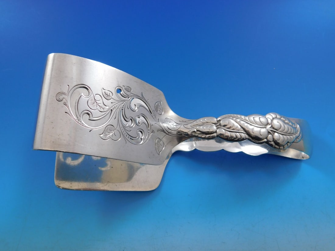 Tiffany & Co Ailanthus Sterling Silver Asparagus Serving Tong Pierced: Tiffany & Co Ailanthus Sterling Silver Asparagus Serving Tong Pierced Presenting an exquisite Ailanthus serving tong from Tiffany & Co., crafted in sterling silver. This elegant pierced asparagus serv