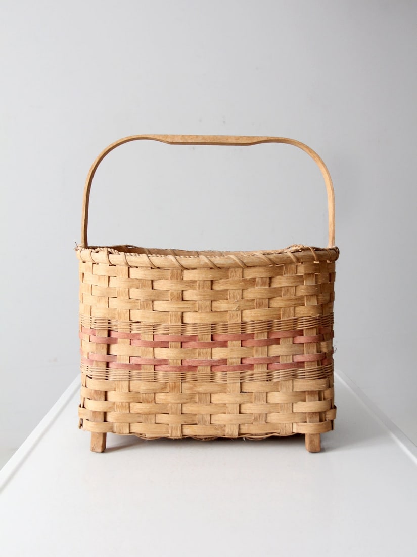 Large American Splint Basket with Footed Base and Arched Handle: Large American Splint Basket with Footed Base and Arched Handle This vintage American splint basket features a footed base, an arched handle, and traditional flat-splint weaving with subtle red accent