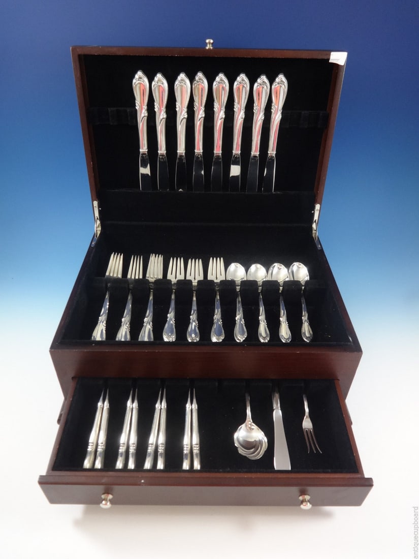 International Sterling Silver Rhapsody Flatware Set 43 Pieces for 8 with Storage Chest: International Sterling Silver Rhapsody Flatware Set 43 Pieces for 8 with Storage Chest Enhance your dining experience with the Rhapsody Sterling Silver Flatware Set by International. This elegant 43-p