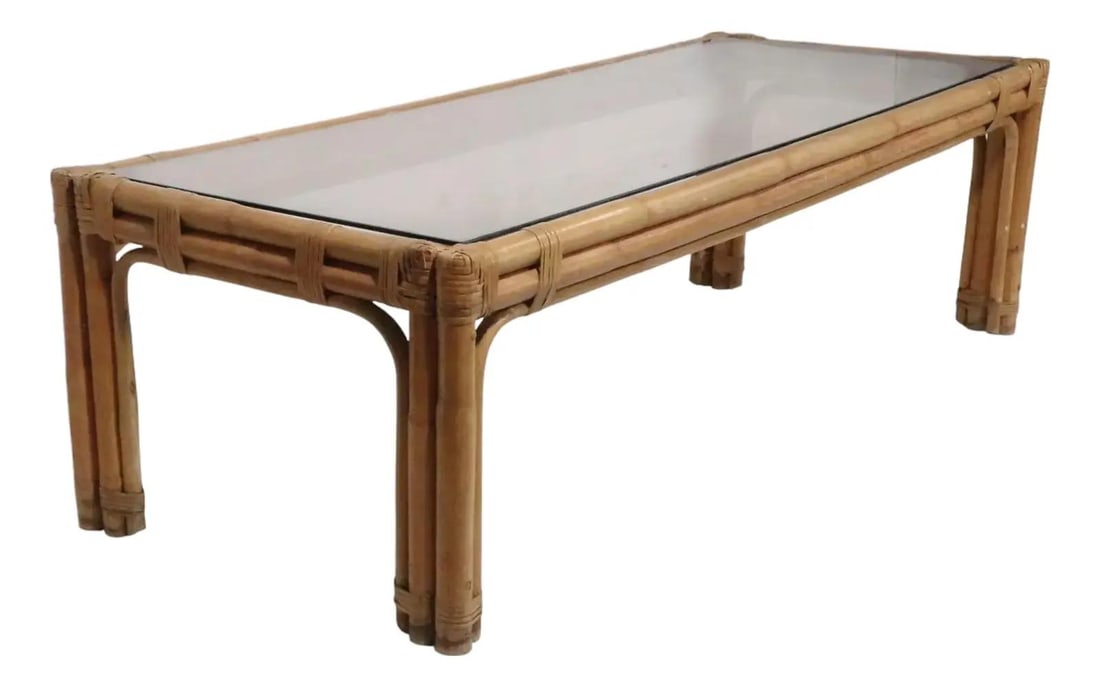 Mid Century Bamboo Coffee Table with Glass Top Classic Design: Mid Century Bamboo Coffee Table with Glass Top Classic Design This classic Mid Century bamboo coffee table features a stylish coastal tiki design, enhanced by a tinted glass top. The table is in good,