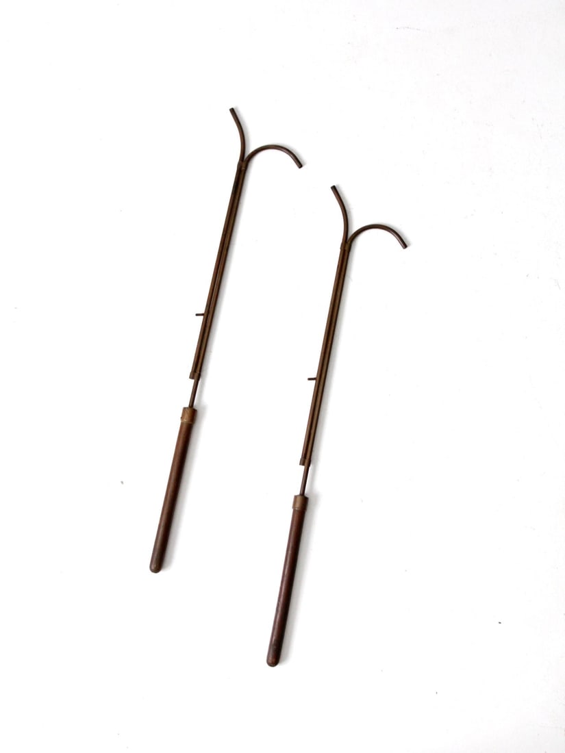 19th Century Antique Copper Candle Lighters with Wooden Handles: 19th Century Antique Copper Candle Lighters with Wooden Handles This pair of 19th-century antique copper candle lighters features slender shafts, forked tips, and smooth turned wooden handles. Their e