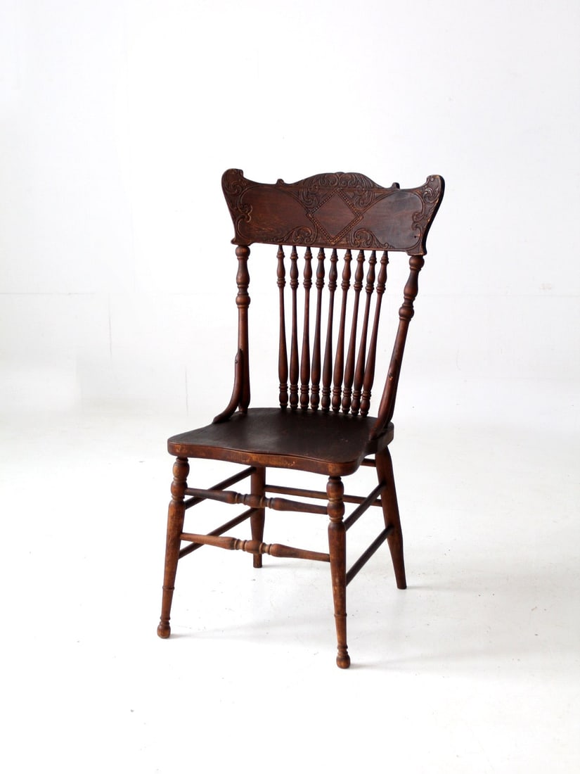 Wisconsin Chair Company Antique Press Back Side Chair: Wisconsin Chair Company Antique Press Back Side Chair This exquisite antique press back side chair, crafted by the Wisconsin Chair Company of Port Washington, WI, features a beautifully decorative cur
