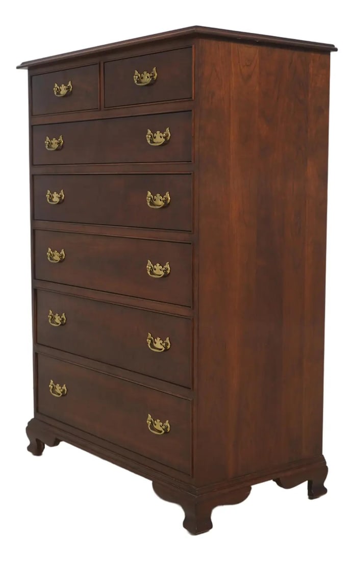High Chest in Solid Cherry Wood with Seven Drawers and Brass Hardware: High Chest in Solid Cherry Wood with Seven Drawers and Brass Hardware This high chest, crafted circa 1986, features a solid cherry wood construction with bracket feet and solid brass hardware. The che