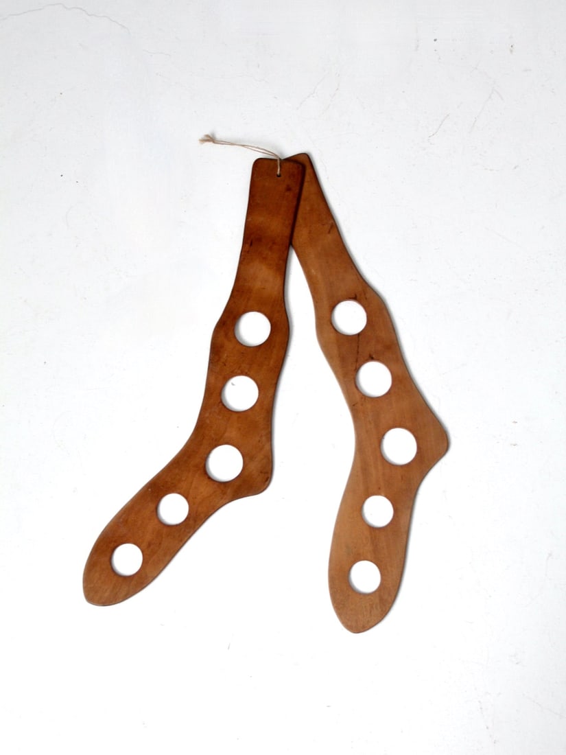 Vintage Wooden Stocking Stretchers with Cut-Out Holes: Vintage Wooden Stocking Stretchers with Cut-Out Holes This pair of antique stocking stretchers is a charming addition to any vintage collection. Crafted from wood, these stretchers feature five round