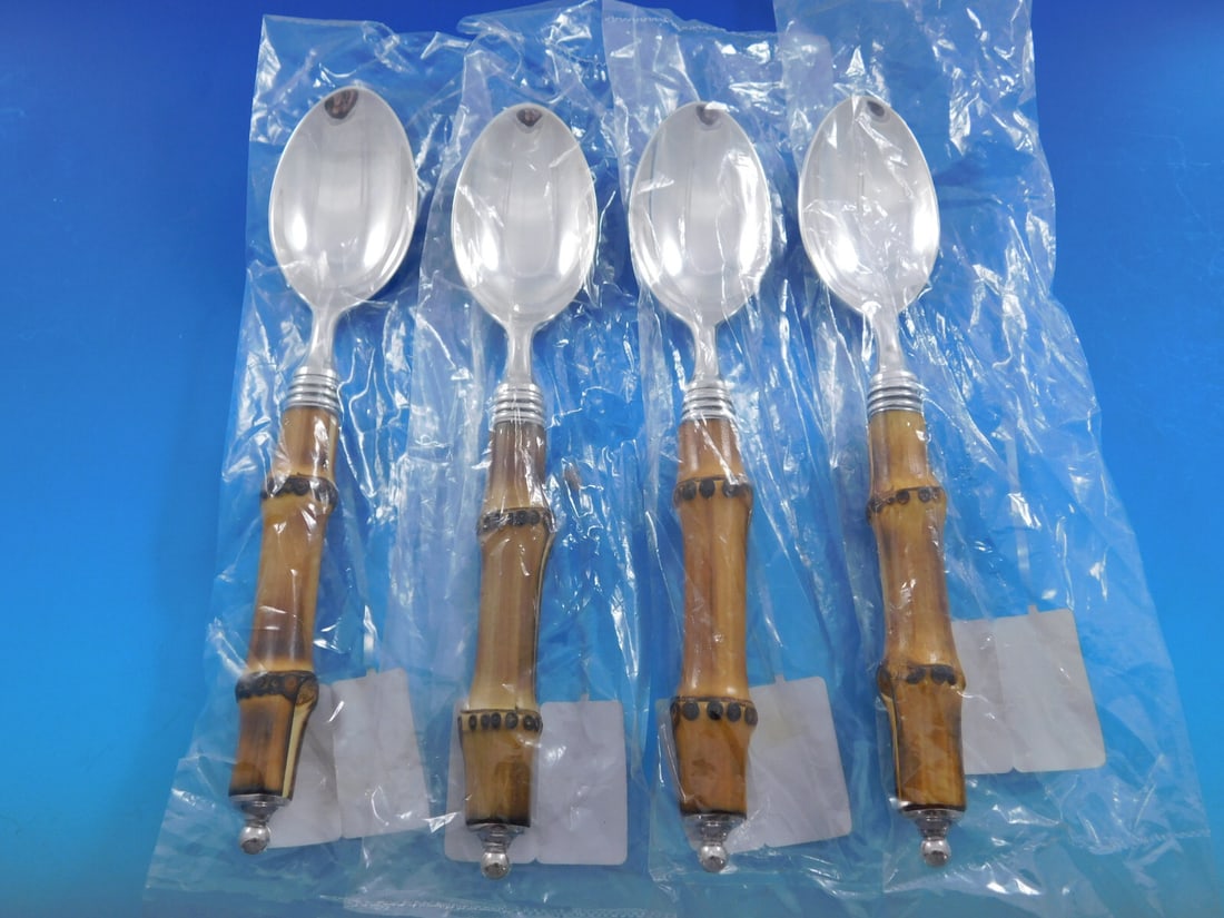 Buccellati Tahiti Sterling Silver Dessert Spoons Set of 4 with Bamboo Handles 7 3/8": Buccellati Tahiti Sterling Silver Dessert Spoons Set of 4 with Bamboo Handles 7 3/8" Discover the exquisite Tahiti Dessert Spoons Set by Buccellati, featuring four elegant sterling silver spoons with