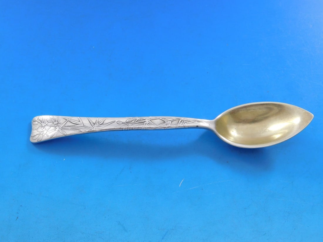 Tiffany Sterling Silver Lap Over Edge Grapefruit Spoon with Dill Motif 6": Tiffany Sterling Silver Lap Over Edge Grapefruit Spoon with Dill Motif 6" This exquisite grapefruit spoon features the classic Lap Over Edge pattern by Tiffany & Co., crafted from high-quality sterlin