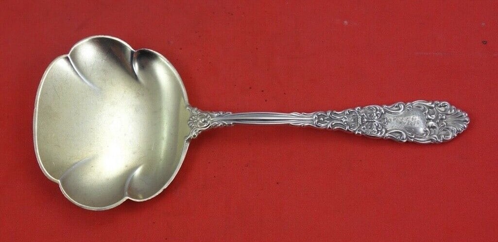 Dominick & Haff Renaissance Sterling Silver Nut Spoon Gold Wash 4.5": Dominick & Haff Renaissance Sterling Silver Nut Spoon Gold Wash 4.5" This exquisite nut spoon is crafted in sterling silver by Dominick & Haff, featuring a luxurious gold wash finish. The spoon, measu