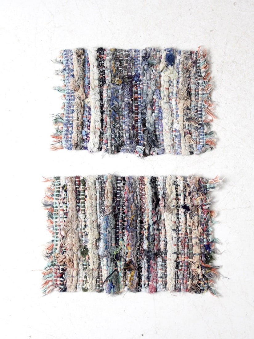 Charming Vintage Handmade Rag Rug Placemats Pair with Blue Accents: Charming Vintage Handmade Rag Rug Placemats Pair with Blue Accents Enhance your dining experience with this charming pair of vintage handmade rag rug placemats. Featuring a thick, knotted weave and el