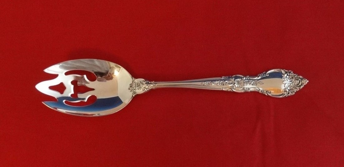 Lunt Belvedere Sterling Silver Slotted Serving Spoon 8 3/8": Lunt Belvedere Sterling Silver Slotted Serving Spoon 8 3/8" This exquisite serving spoon is a stunning example of the Belvedere pattern by Lunt, crafted from high-quality sterling silver. Measuring 8