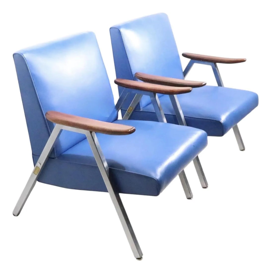 Pair of Royal Metal Mid Century Lounge Chairs Blue Vinyl: Pair of Royal Metal Mid Century Lounge Chairs Blue Vinyl This pair of iconic Mid Century lounge chairs, crafted by Royal Metal Furniture Company, dates back to the 1950s-1970s. The chairs feature a ro