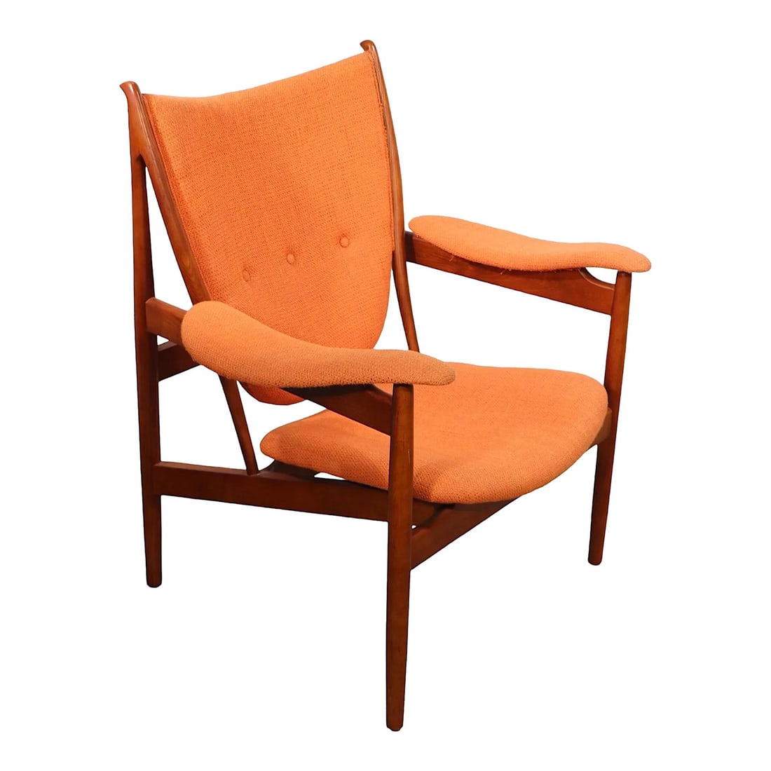 Finn Juhl Reproduction Chieftain Chair Orange Upholstery: Finn Juhl Reproduction Chieftain Chair Orange Upholstery Experience the charm of mid-century design with the iconic Chieftain Chair, originally designed by Finn Juhl. This reproduction piece is in goo