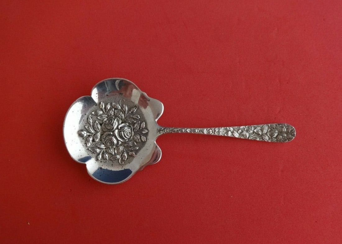Schofield Baltimore Rose Sterling Silver Nut Spoon Floral Design 4 7/8": Schofield Baltimore Rose Sterling Silver Nut Spoon Floral Design 4 7/8" This exquisite serving spoon, known as the Baltimore Rose Nut Spoon, is crafted from high-quality sterling silver. Designed by S