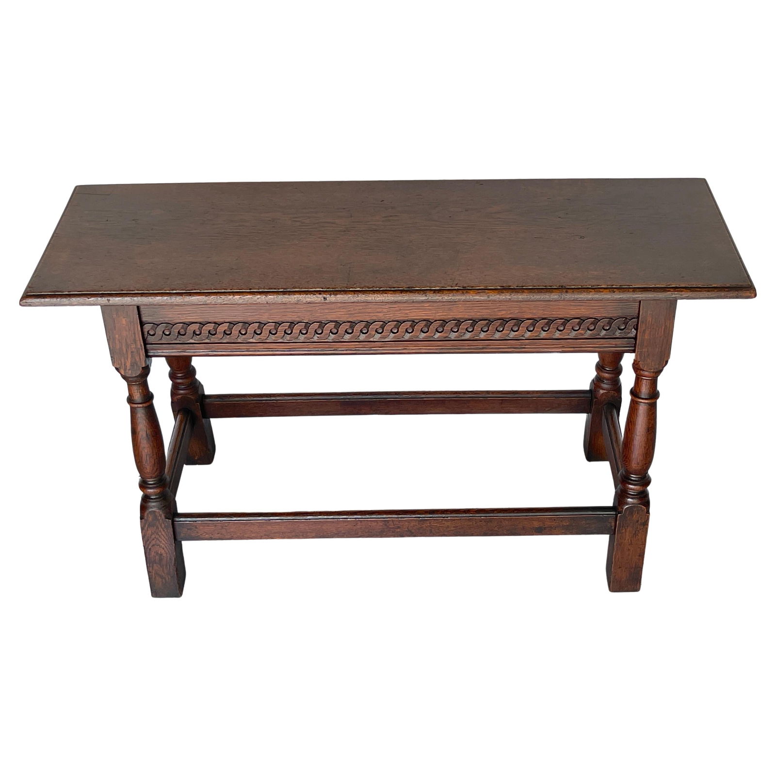 James II Style Carved Oak Bench Table England 1920s with Hidden Storage: James II Style Carved Oak Bench Table England 1920s with Hidden Storage This James II Style Carved Oak Bench/Side Table from England, dating back to the 1920s, showcases the classic elegance and craft