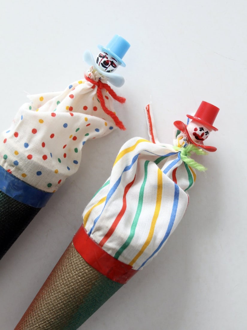 Vintage Cloth Clown Cone Puppets Pair with Wooden Pulls: Vintage Cloth Clown Cone Puppets Pair with Wooden Pulls This charming pair of vintage pop-up clown cone puppets brings a delightful touch to any toy collection. Each puppet features a colorful cloth c