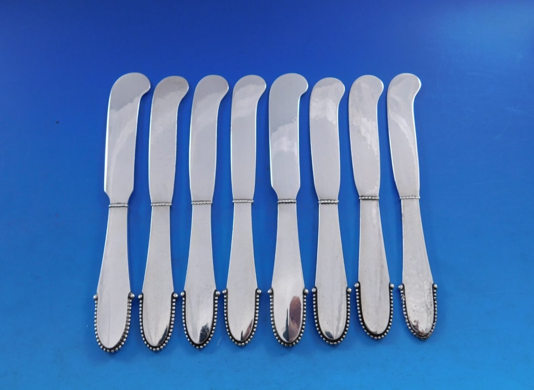 Georg Jensen Beaded Sterling Silver Butter Spreader Set of 8: Georg Jensen Beaded Sterling Silver Butter Spreader Set of 8 Enhance your dining experience with this elegant set of 8 butter spreaders from Georg Jensen, featuring the classic Beaded pattern. Each sp