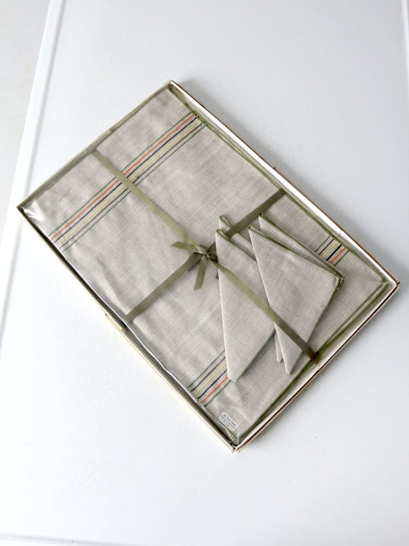 1950s Timely Linens Napkin and Placemat Set with Rainbow Stripes: 1950s Timely Linens Napkin and Placemat Set with Rainbow Stripes Elevate your dining experience with this charming Vintage 1950s Timely Linens Napkin and Placemat Set. This exquisite set, preserved in