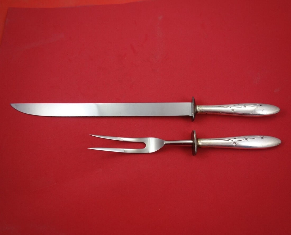 Gorham Celeste Sterling Silver 2pc Roast Carving Set Knife Fork: Gorham Celeste Sterling Silver 2pc Roast Carving Set Knife Fork Elevate your dining experience with the Celeste Roast Carving Set by Gorham. This exquisite 2-piece set features a sterling silver hollo