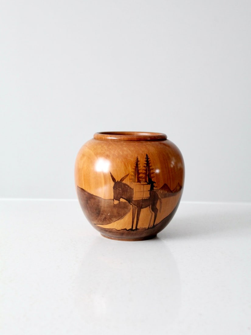 Handcrafted Vintage Southwestern Wooden Vase with Donkey Design: Handcrafted Vintage Southwestern Wooden Vase with Donkey Design Discover this charming vintage wooden vase, beautifully hand-crafted with a Southwestern theme. The vase features a detailed design of a
