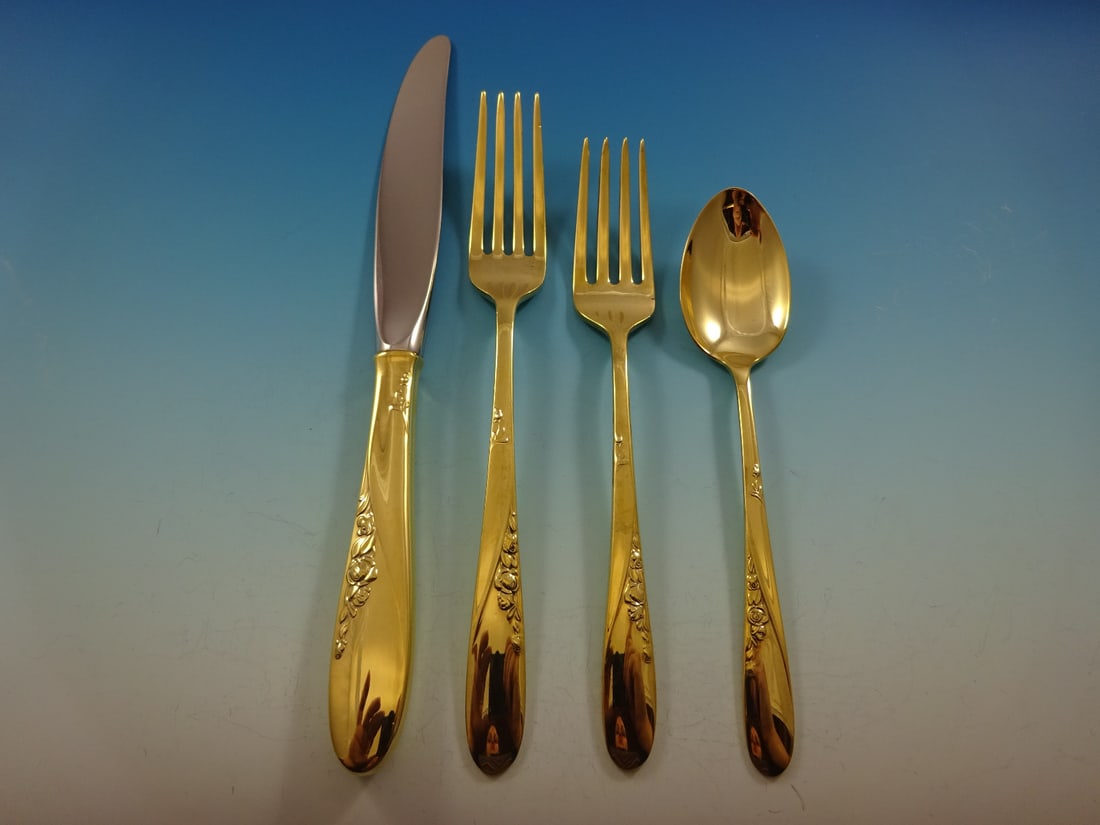 Easterling Rose Spray Gold Vermeil Sterling Silver Flatware Set 48 Pieces: Easterling Rose Spray Gold Vermeil Sterling Silver Flatware Set 48 Pieces Elevate your dining experience with this exquisite Rose Spray Gold flatware set by Easterling. Crafted from sterling silver an