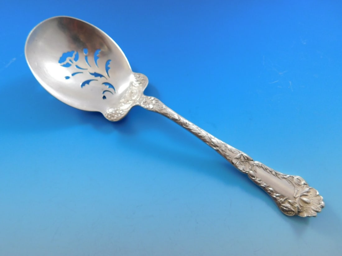 Gorham Poppy Sterling Silver 8 3/4 Inch Ice Serving Spoon: Gorham Poppy Sterling Silver 8 3/4 Inch Ice Serving Spoon This exquisite serving spoon, crafted from sterling silver, features a delicate pierced design adorned with poppies, embodying the elegance of