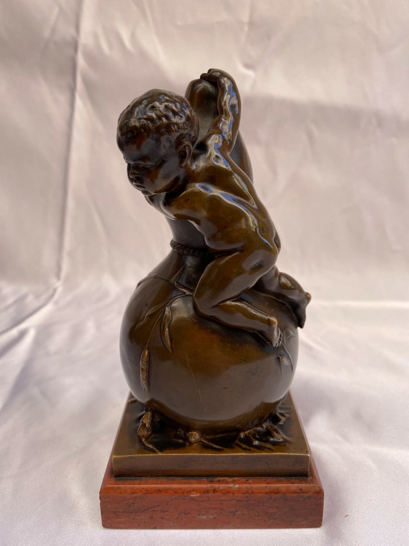 19th Century Bronze Sculpture by Louis Kley Baby Boy on Marble Base: 19th Century Bronze Sculpture by Louis Kley Baby Boy on Marble Base This exquisite 19th century French bronze sculpture by the renowned artist Louis Kley (born 1833) captures a charming scene of a bab