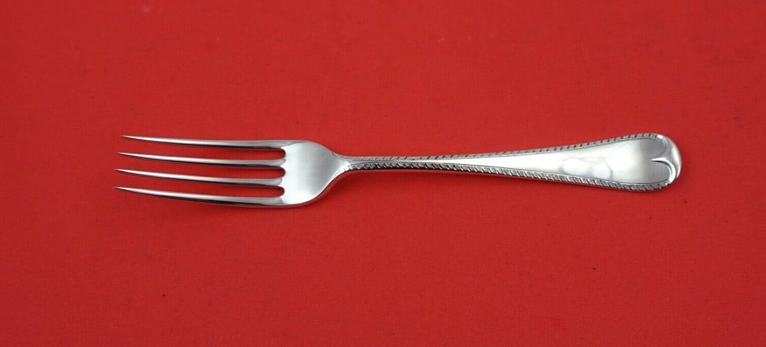 James Robinson Feather Edge Sterling Silver Salad Fork 6 7/8": James Robinson Feather Edge Sterling Silver Salad Fork 6 7/8" This exquisite salad/luncheon fork is crafted from sterling silver and features the elegant Feather Edge pattern by James Robinson. Measur