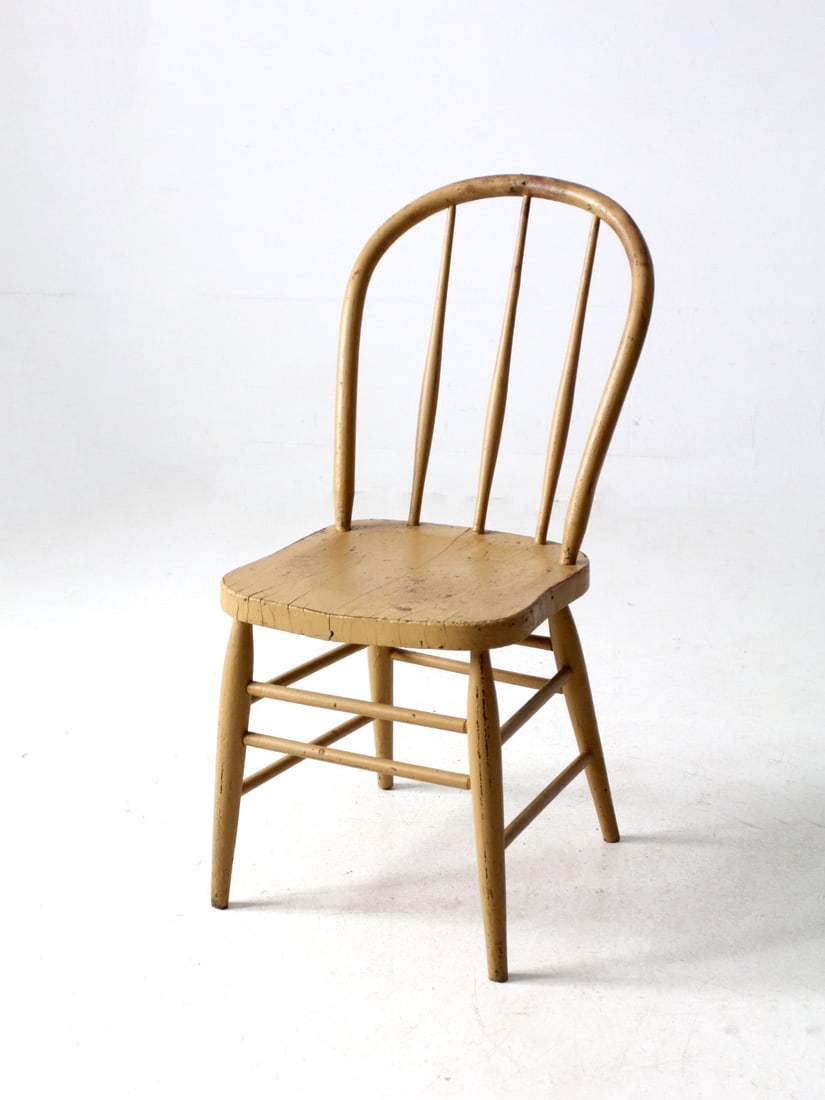 Vintage Bow Back Windsor Chair Mustard Yellow Farmhouse Accent: Vintage Bow Back Windsor Chair Mustard Yellow Farmhouse Accent This vintage bow back Windsor chair showcases classic spindle styling and is adorned with a creamy mustard yellow painted finish, exuding