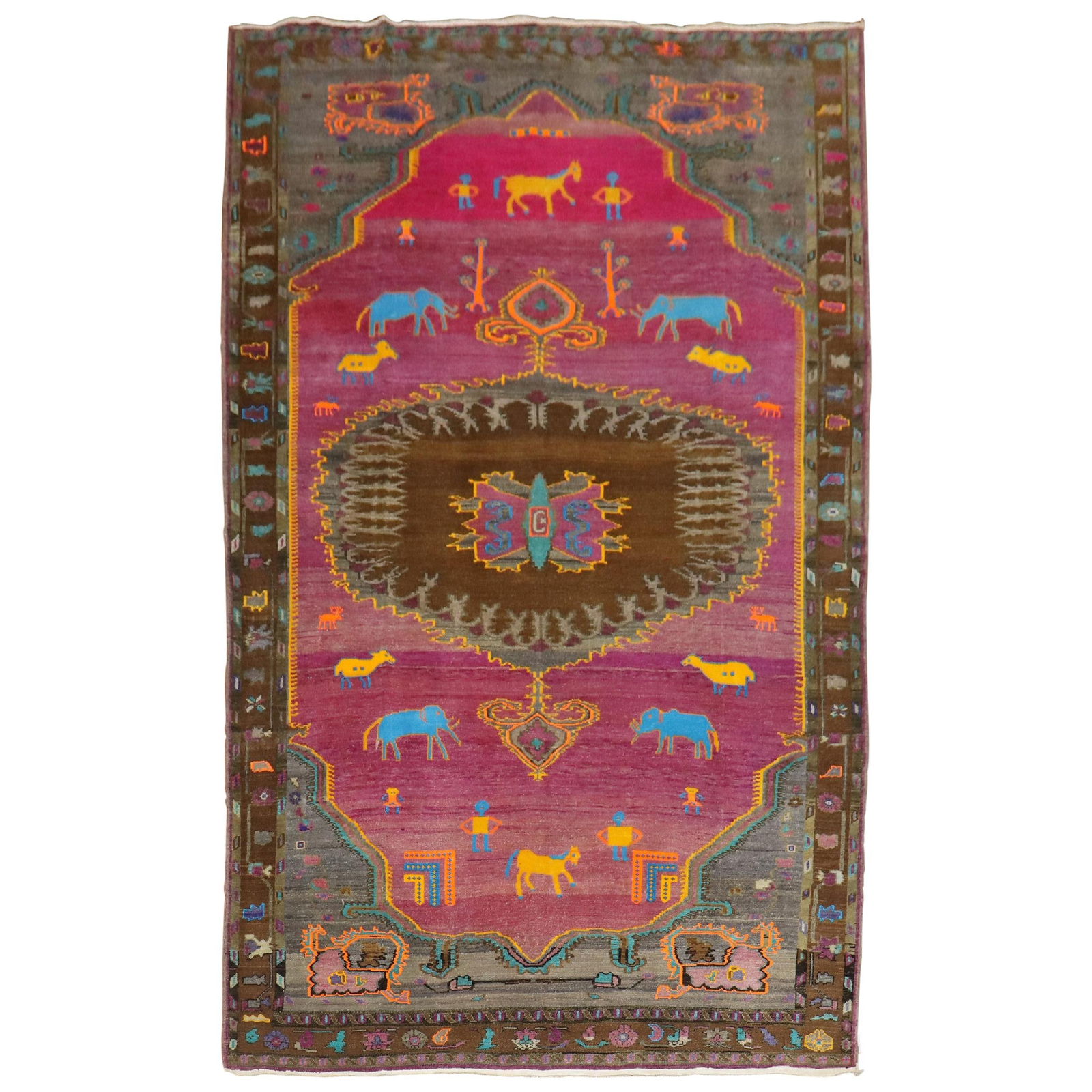 Unique Mid-20th Century Turkish Wool Rug Animal Human Motif: Unique Mid-20th Century Turkish Wool Rug Animal Human Motif This unique Turkish rug showcases a whimsical animal and human figurative motif on a vibrant fuchsia ground. Crafted from hand-knotted wool,