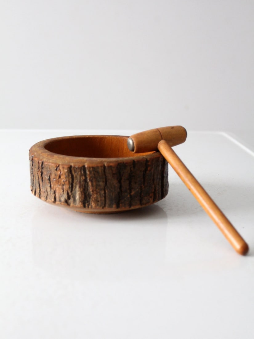 Vintage Mid-Century Nut-Cracker Bowl Set with Wooden Mallet: Vintage Mid-Century Nut-Cracker Bowl Set with Wooden Mallet This Mid-Century Nut-Cracker Bowl Set is a charming and functional addition to your kitchen or coffee table. Crafted in the mid-20th century