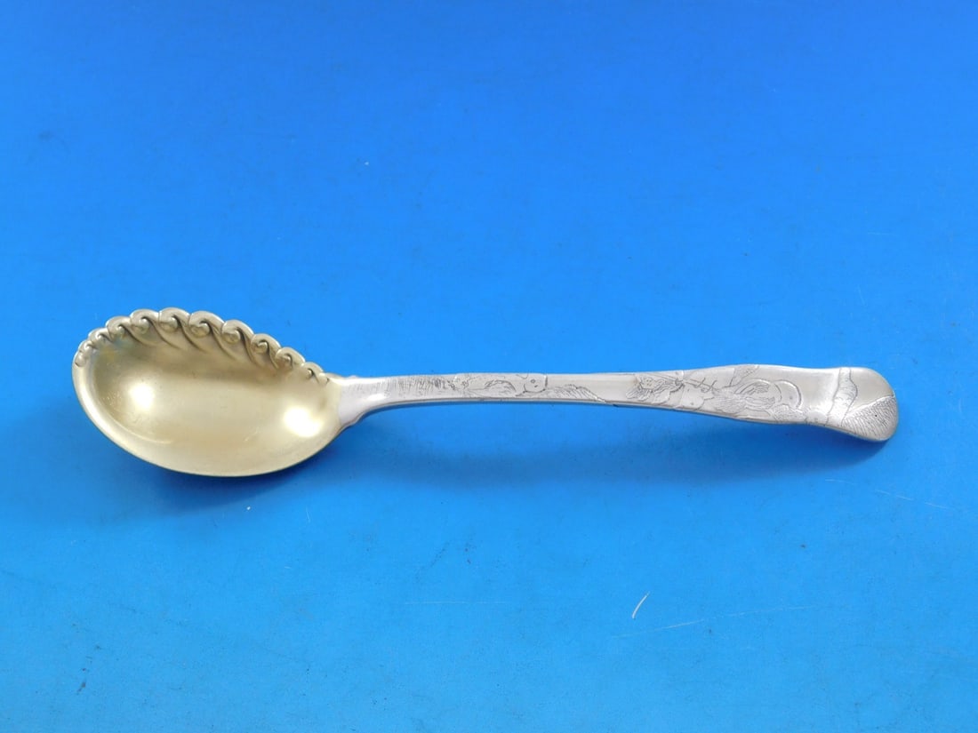 Tiffany & Co. Sterling Silver Acid Etched Ice Cream Spoon Ruffled Bird Motif: Tiffany & Co. Sterling Silver Acid Etched Ice Cream Spoon Ruffled Bird Motif Indulge in a touch of elegance with this stunning sterling silver ice cream spoon from Tiffany & Co. This exquisite piece f