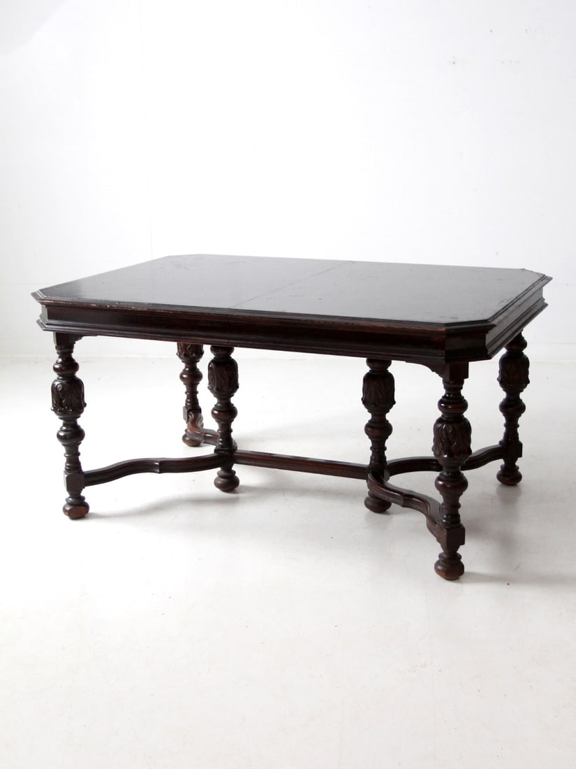 Antique Jacobean Revival Dining Table with Intricate Carved Legs: Antique Jacobean Revival Dining Table with Intricate Carved Legs This antique Jacobean Revival dining table showcases a stunning design with intricately carved and turned wood legs, embodying the bold