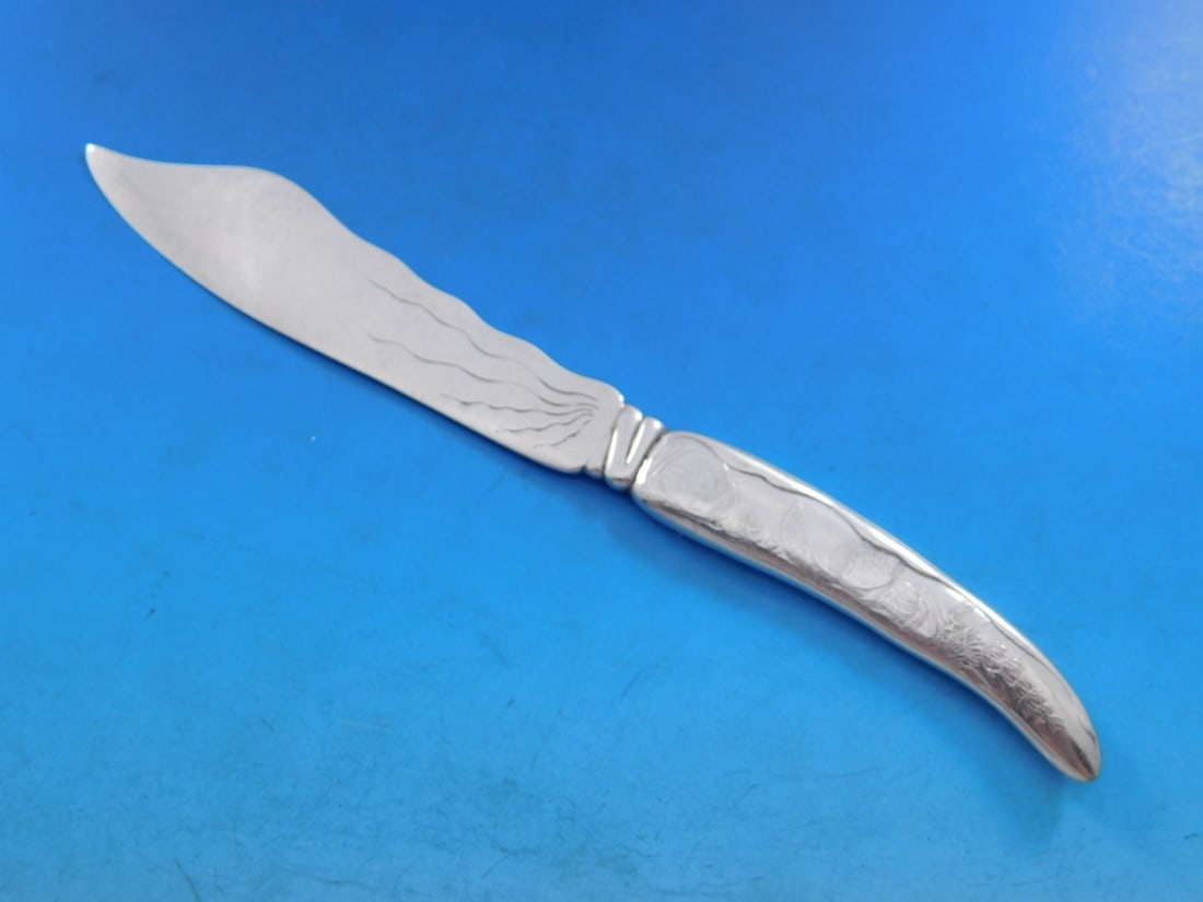 Tiffany Sterling Silver Lap Over Edge Fish Knife 7 7/8 Sea Life Motif: Tiffany Sterling Silver Lap Over Edge Fish Knife 7 7/8 Sea Life Motif Discover this exquisite fish knife, crafted by Tiffany & Co. in the elegant Lap Over Edge pattern. Made entirely of sterling silve