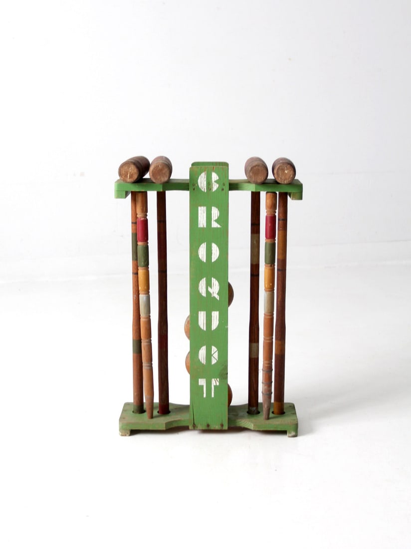 Vintage Mid Century Croquet Set with Wooden Mallets and Stand: Vintage Mid Century Croquet Set with Wooden Mallets and Stand This mid 20th century croquet set is perfect for outdoor fun. The classic lawn game includes four wooden mallets, four wooden balls, two p