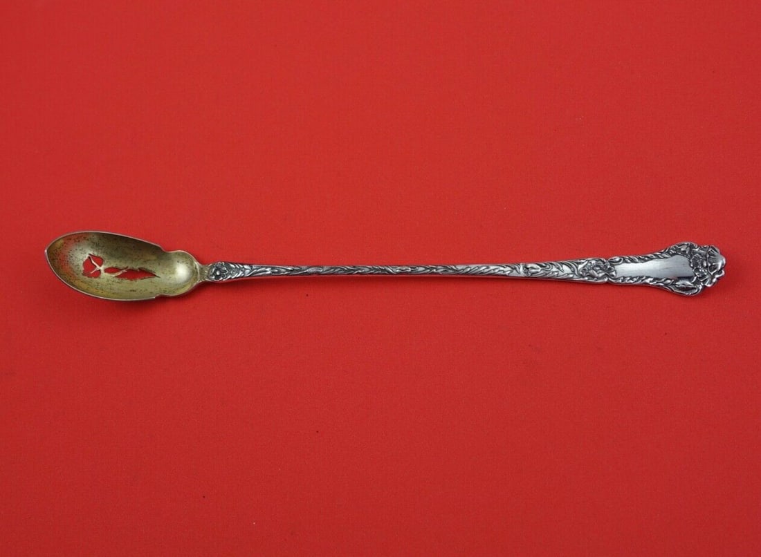 Gorham Poppy Sterling Silver Gold-Washed Olive Spoon 8 3/4": Gorham Poppy Sterling Silver Gold-Washed Olive Spoon 8 3/4" Discover the elegance of the Poppy pattern by Gorham with this exquisite sterling silver olive spoon. Measuring 8 3/4 inches, this long serv
