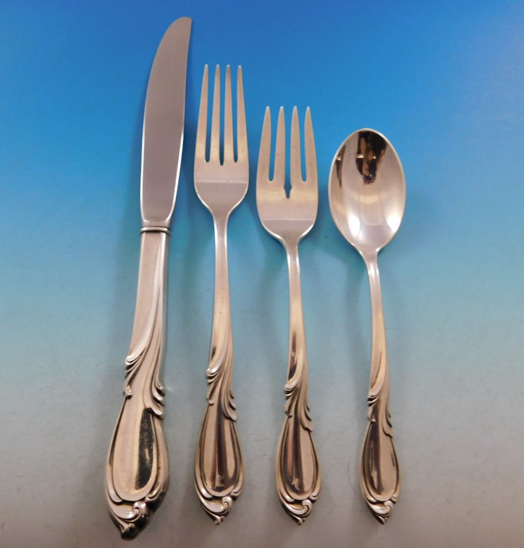Rhapsody International Sterling Silver Flatware Set for 12 - 51 Pieces with Storage Chest: Rhapsody International Sterling Silver Flatware Set for 12 - 51 Pieces with Storage Chest Enhance your dining experience with the Rhapsody by International Sterling Silver Flatware Service for 12. Thi