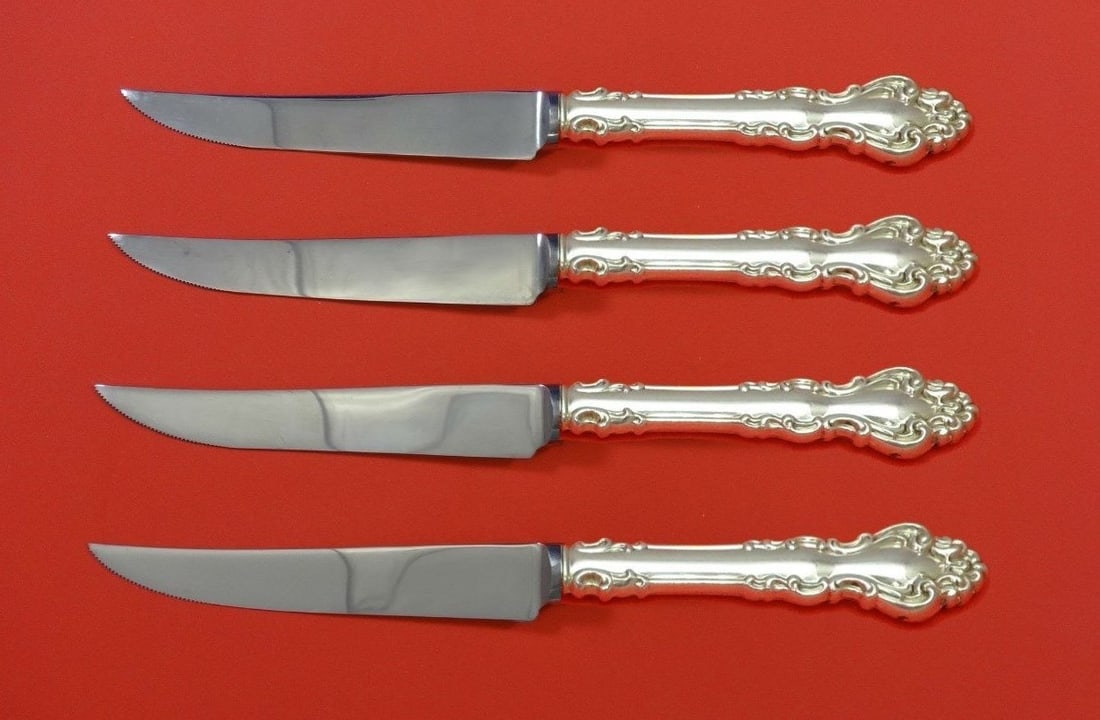 Reed and Barton Spanish Baroque Sterling Silver Steak Knife Set 4pc: Reed and Barton Spanish Baroque Sterling Silver Steak Knife Set 4pc This exquisite 4-piece steak knife set features the Spanish Baroque pattern by Reed & Barton, crafted from high-quality sterling sil